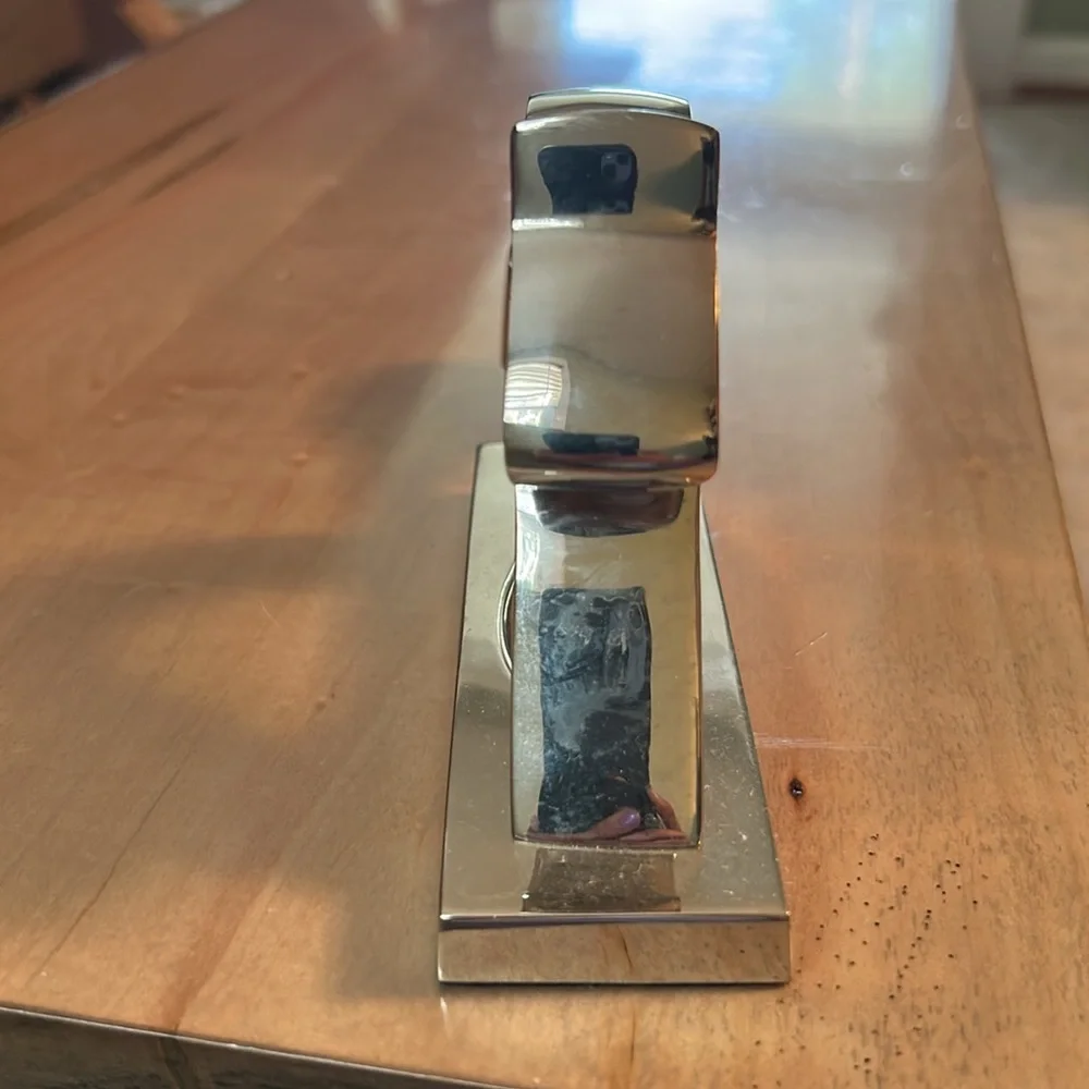 Crate and Barrel chromed squirrel nutcracker. Never used. Still has sticker.